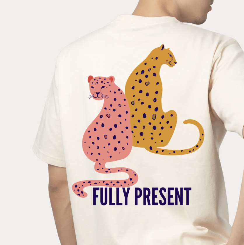 Cream Present AF t-shirt with the two sitting cheetahs and Fully Present wordmark printed on the back